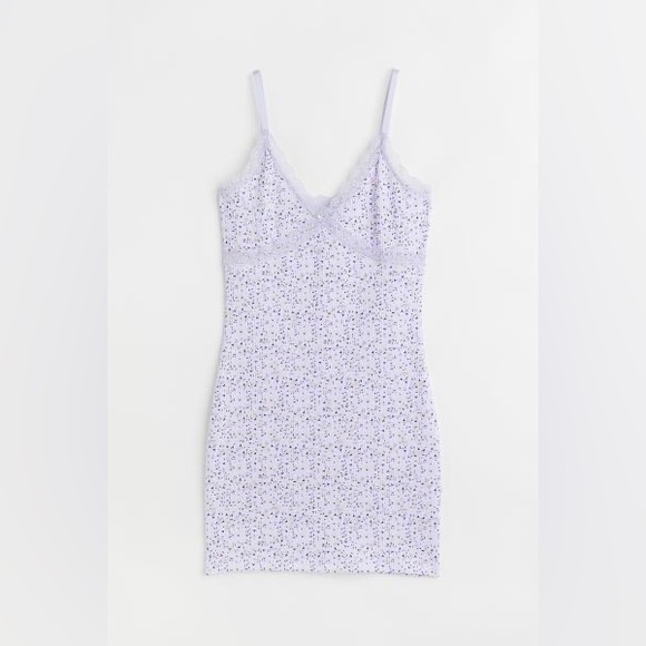 Narrow, adjustable shoulder straps and V-neck with lace trim at top. Unlined. - Picture 4 of 4